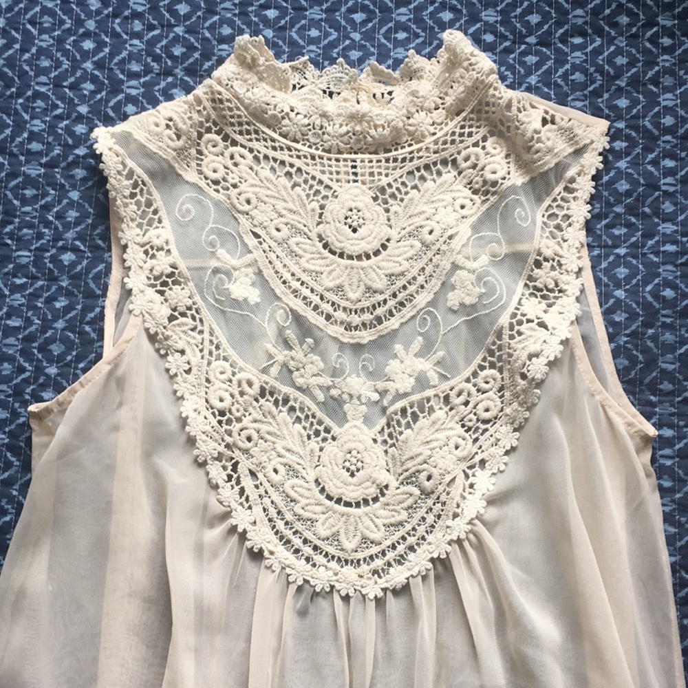 Beautiful cream sleeveless Blouse Medium